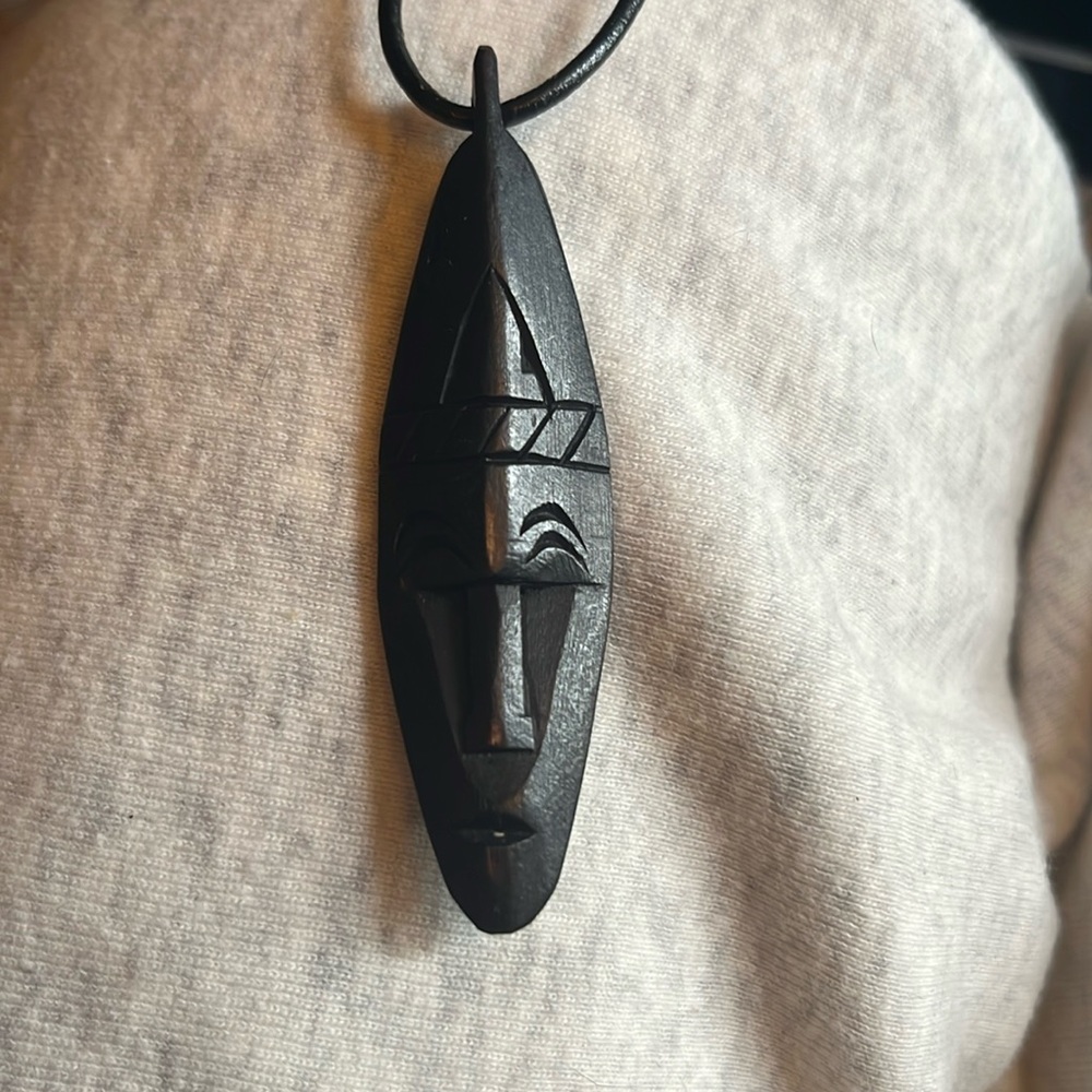 African mask black wood pendant on 12 inch (doubled up) leather cord, unworn.